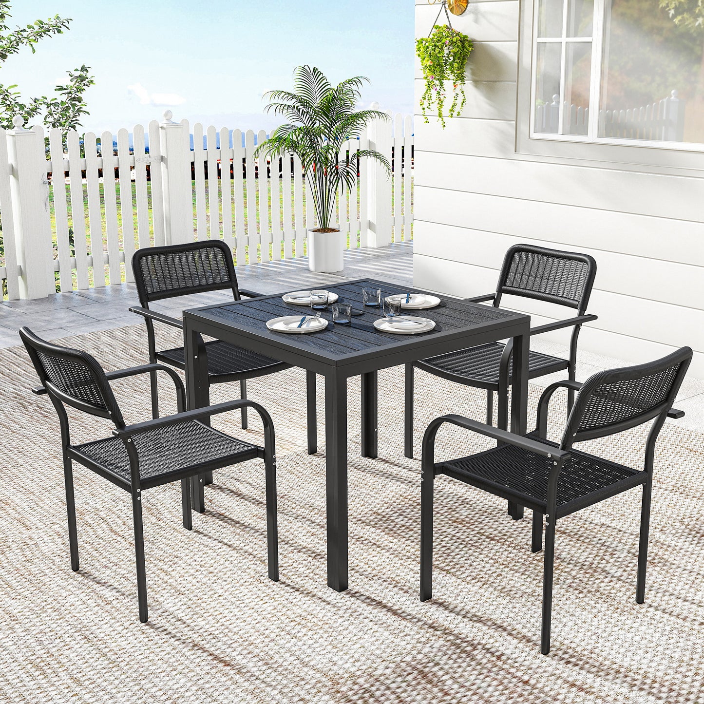 Outdoor Dining Set for 4, Faux Wood Metal Patio Table and Stackable Chairs with Plastic Rattan Effect Seat, Black